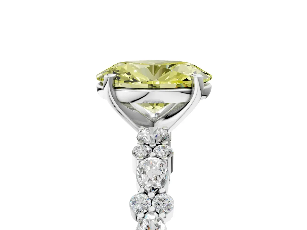 Fancy Yellow Oval Cut Diamond Side Stone Solitaire Ring with Round and Four-Prong Setting Platinum
