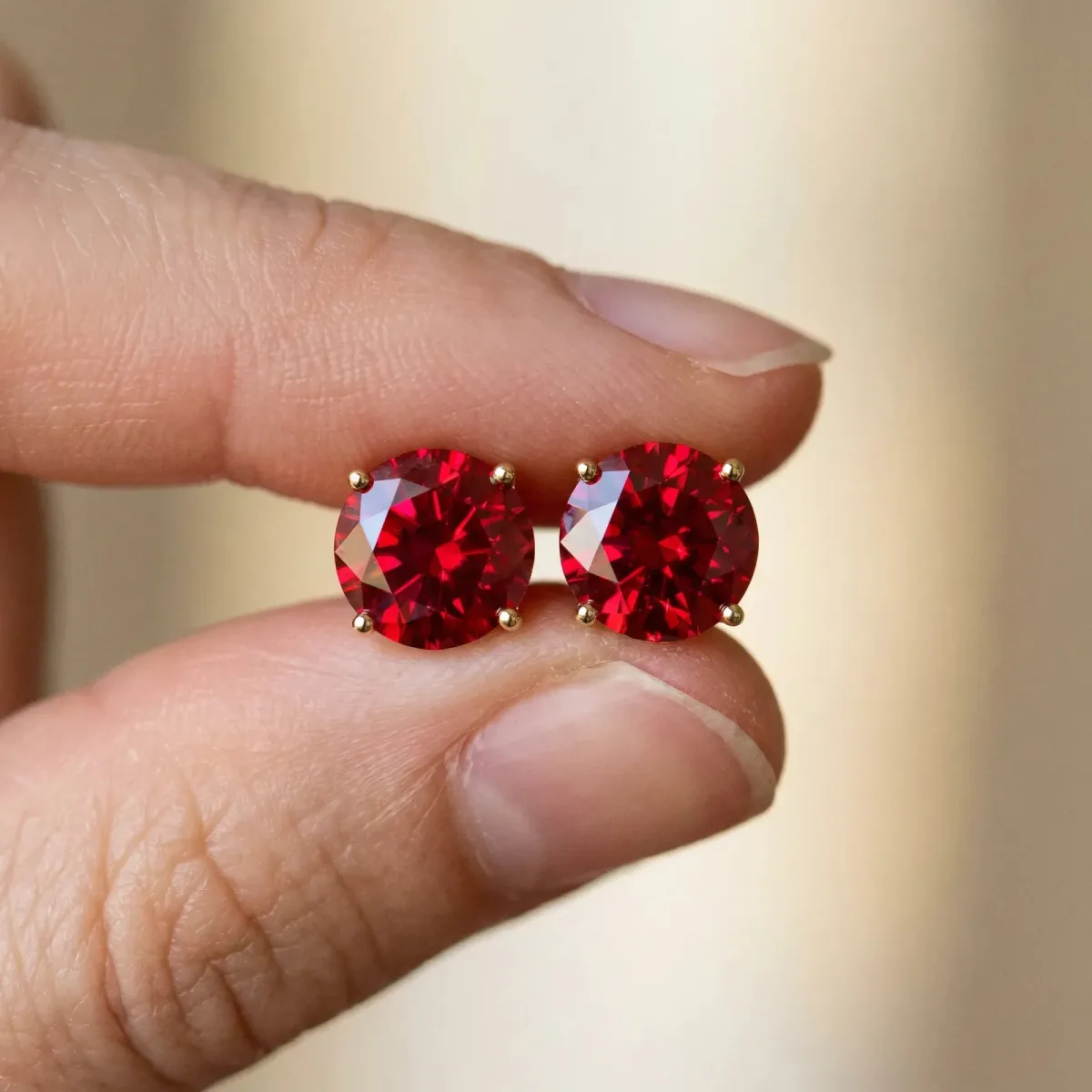 Round Cut Ruby Stud Earrings Yellow gold