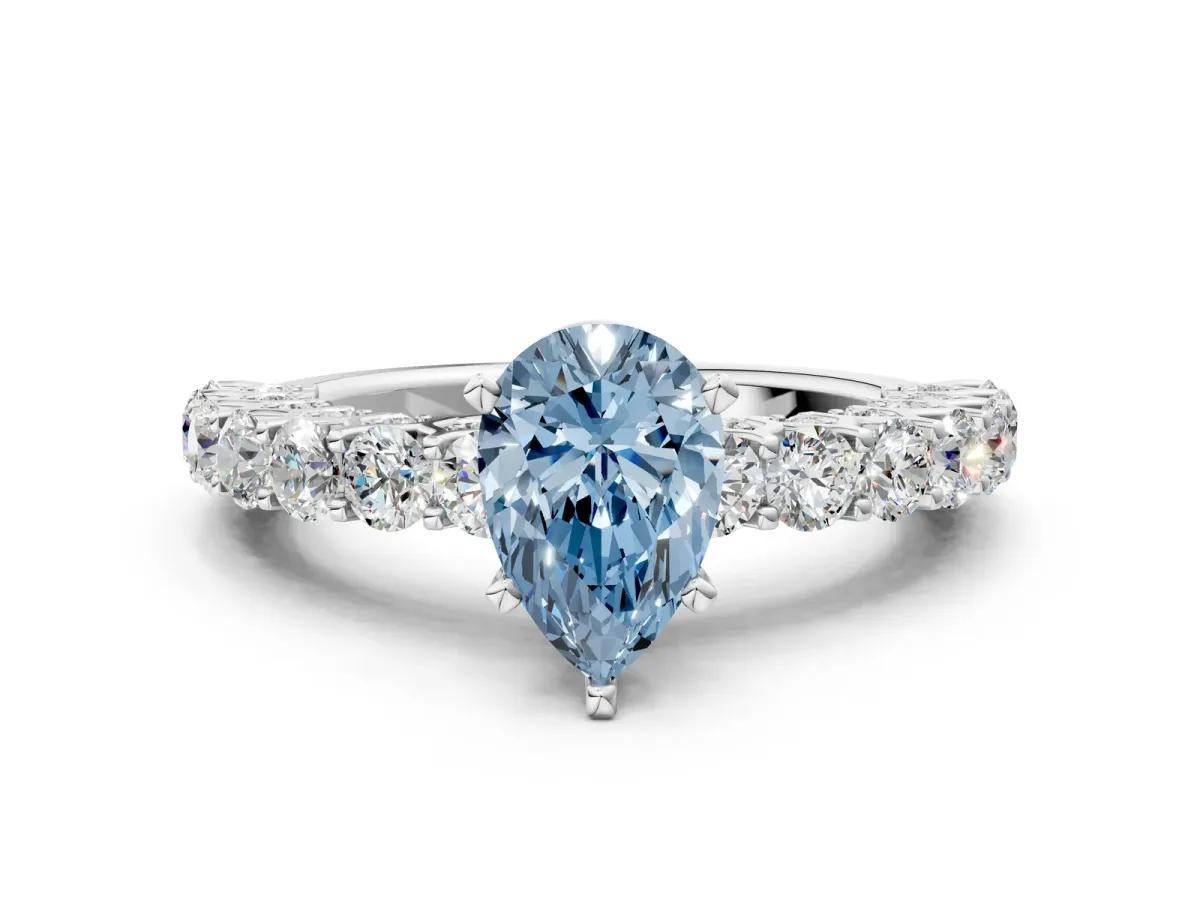 Fancy Blue Pear Cut Diamond Solitaire Ring with Shared Prong Pavé Band and Four-Prong Setting Silver