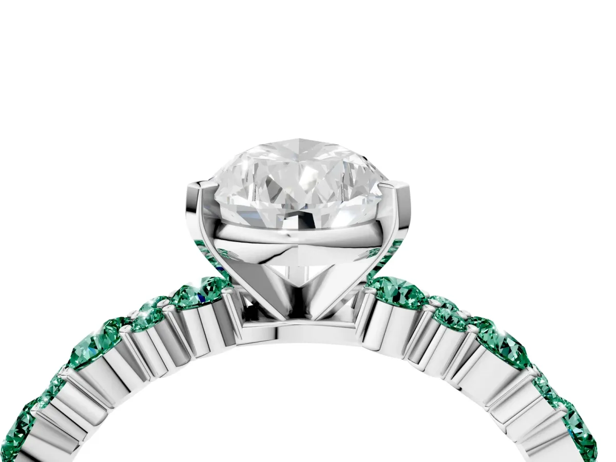Pear Cut Diamond Side Stone Solitaire Ring with Round Green Sapphire and Four-Prong Setting Silver