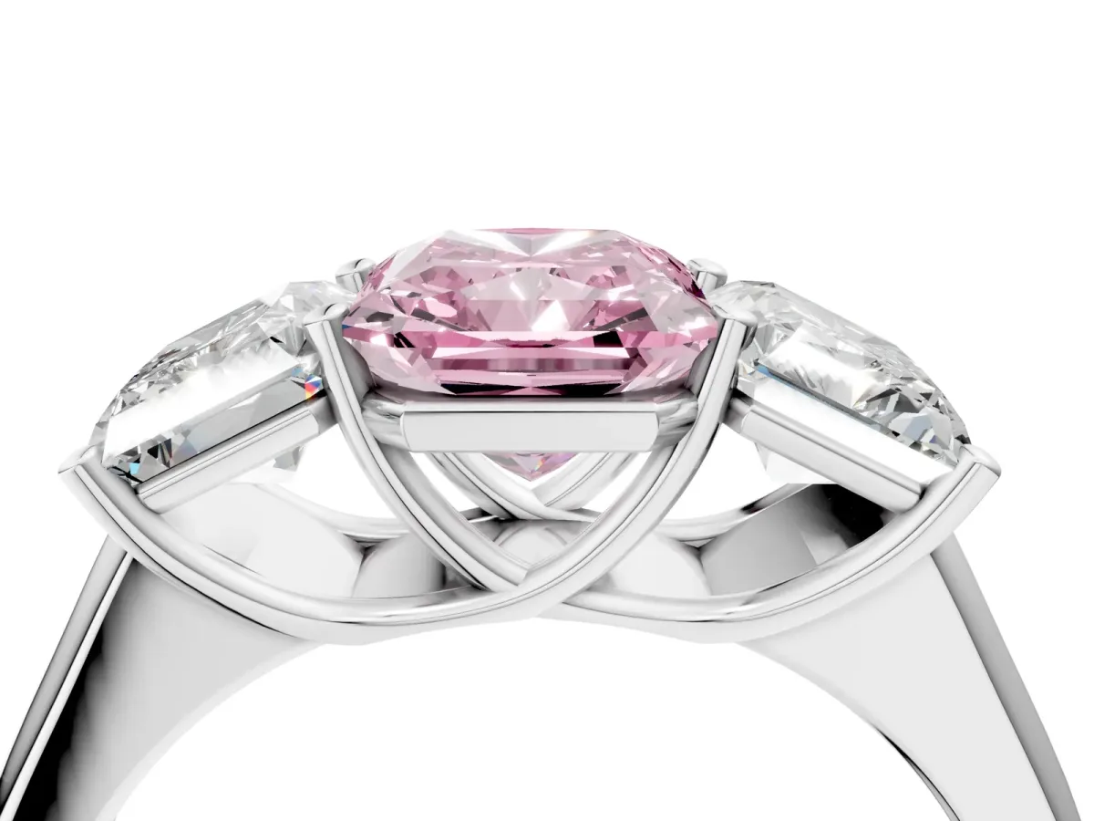 Fancy Pink Radiant Cut Three-Stone Diamond Ring with Prong Setting on a Classic Band Platinum