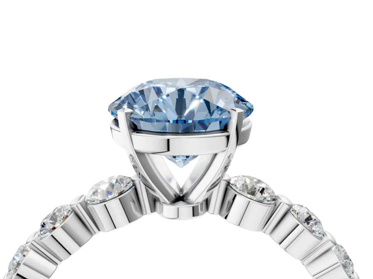 Fancy Blue Round Cut Solitaire Diamond Ring with Pave Band and Four-Prong Setting Silver