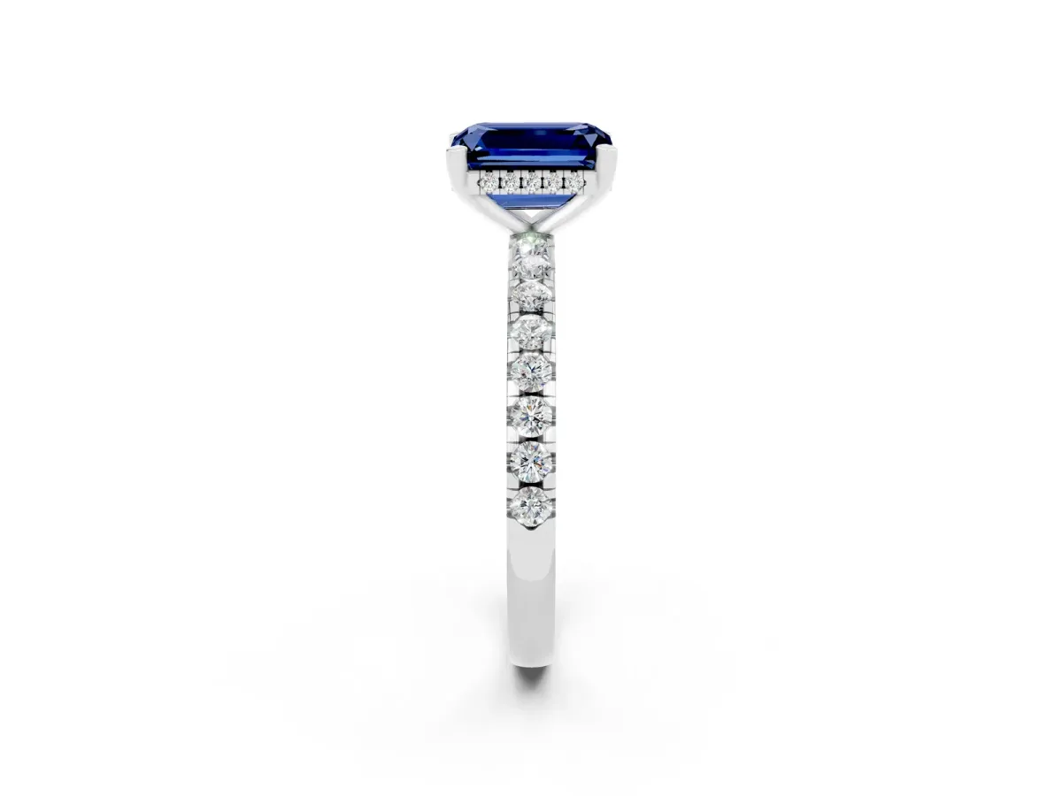 Emerald Cut Blue Sapphire Solitaire Ring with Round Pavé Band and Four-Prong Setting Silver