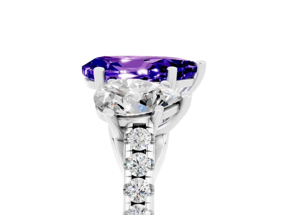 Three-Stone Pear Cut Tanzanite Ring with Round Pavé Band and Prong Setting Platinum