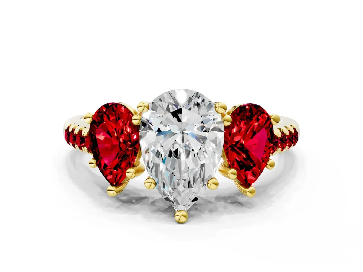 Three-Stone Pear Cut Diamond Ring with Round Ruby Pavé Band and Prong Setting Yellow gold