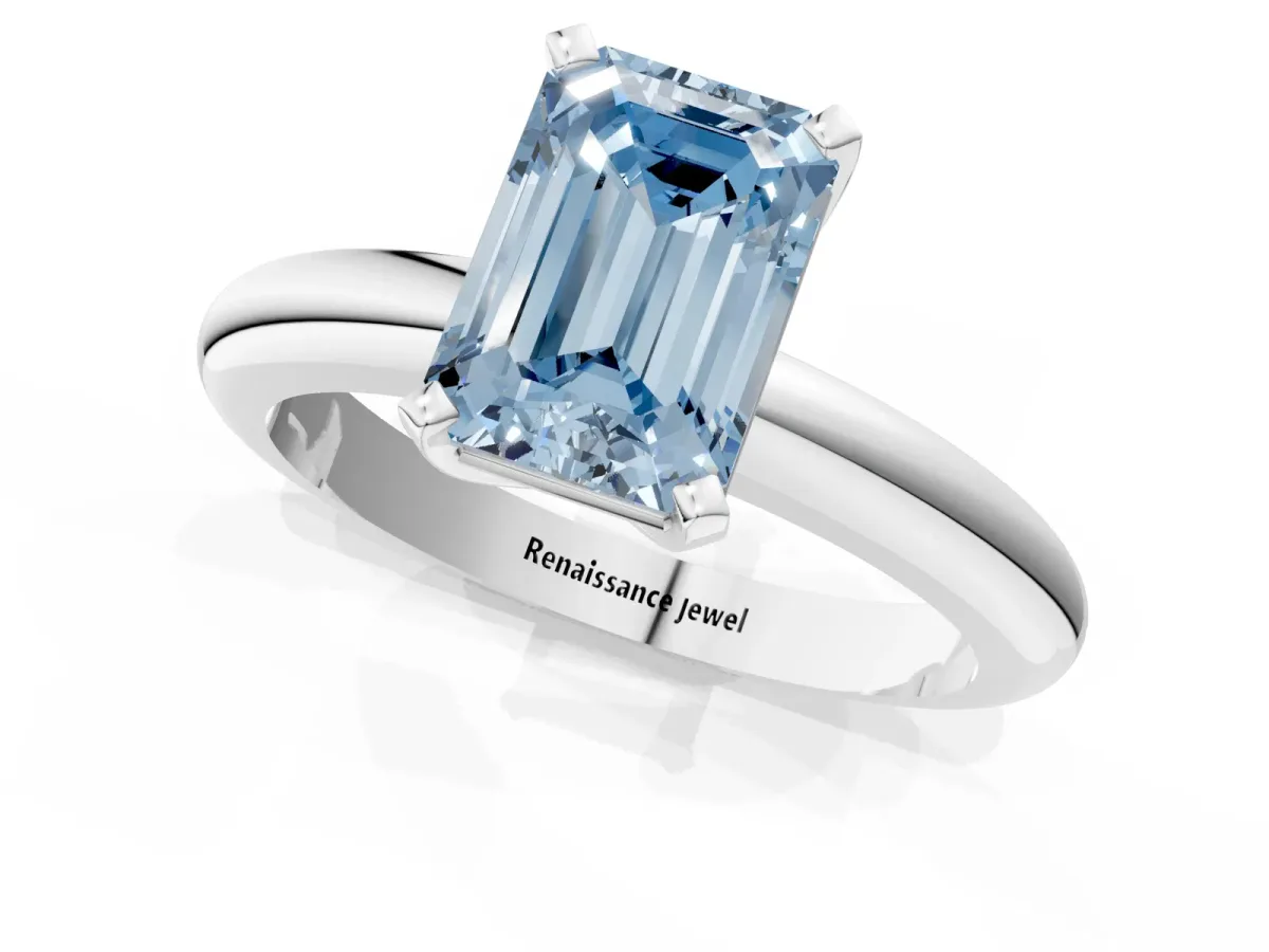 Fancy Blue Emerald Cut Diamond Solitaire Engagement Ring with Round Band and Four-Prong Setting Silver