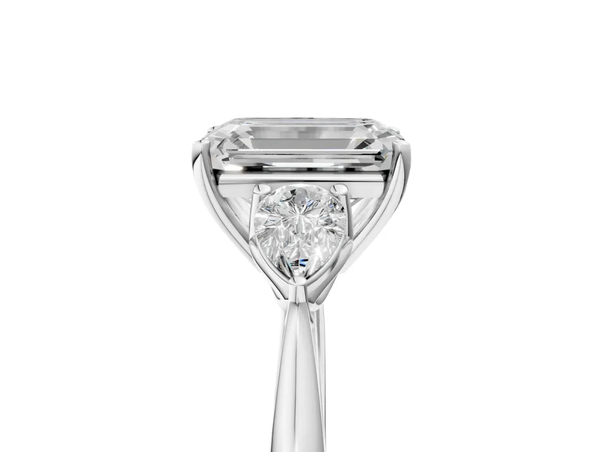 Three-Stone Emerald Cut Diamond Ring with Pear Side Stones in Four-Prong Setting White gold