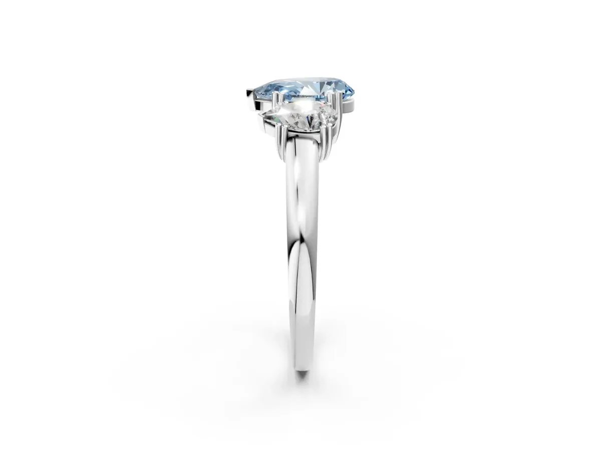 Fancy Blue Three-Stone Pear Cut Cut Diamond Ring with Channel Set Band and Four-Prong Setting Silver