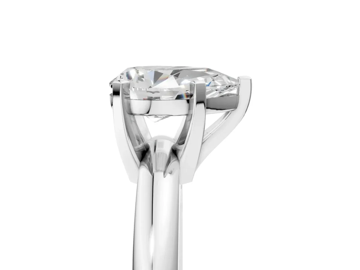 Pear Cut Diamond Solitaire Engagement Ring with Round Band and Four-Prong Setting Silver