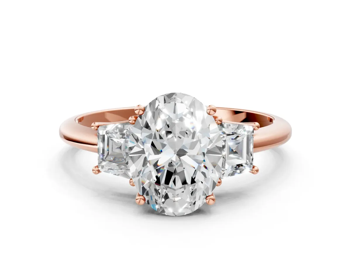 Oval Cut Diamond Three-Stone Ring with Trapezoid Side Stones and Prong Setting Rose gold
