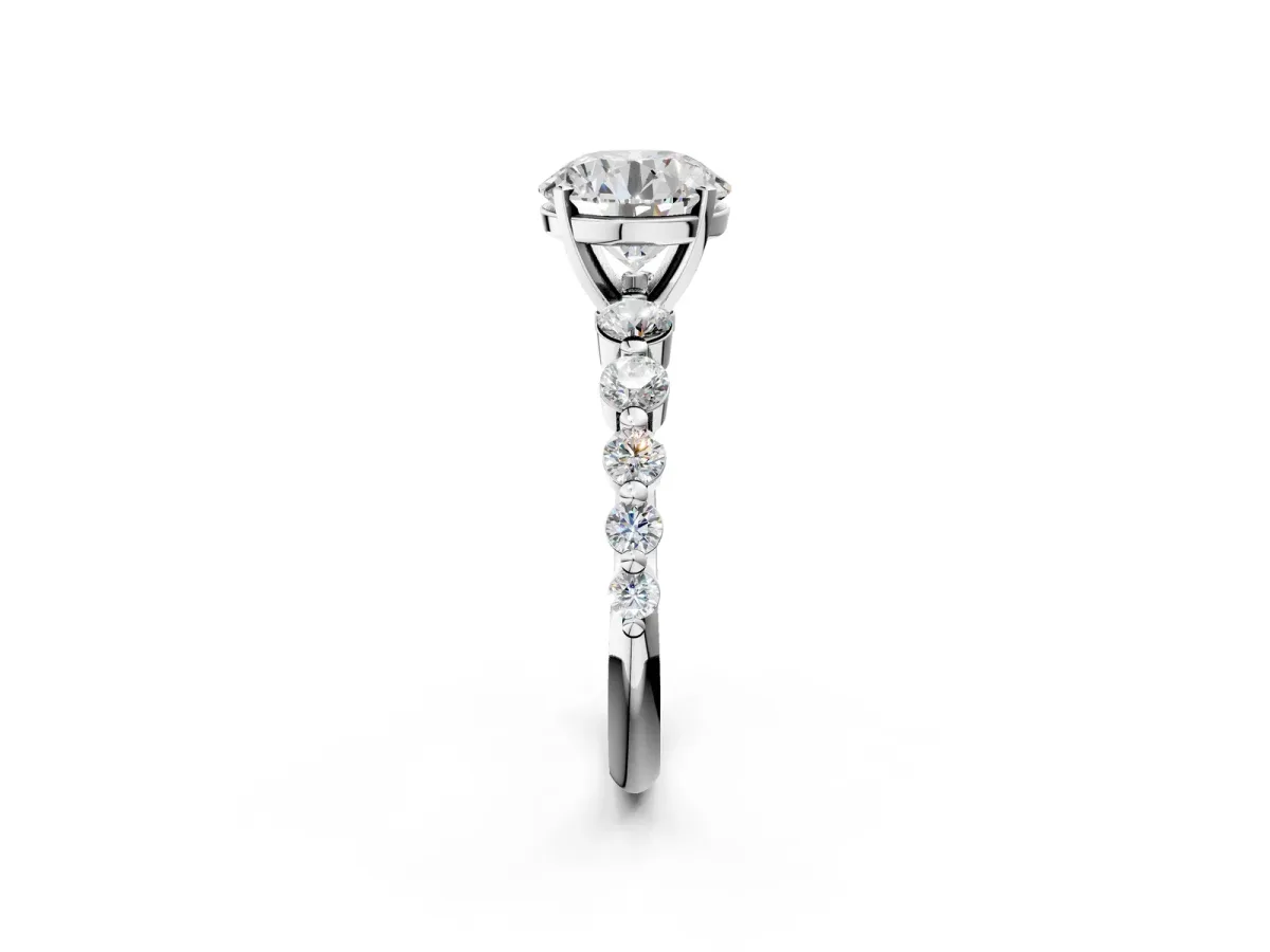 Round Cut Solitaire Diamond Ring with Pave Band and Four-Prong Setting Silver