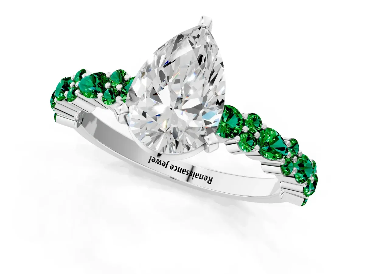 Pear Cut Diamond Side Stone Solitaire Ring with Round Emerald and Four-Prong Setting Silver