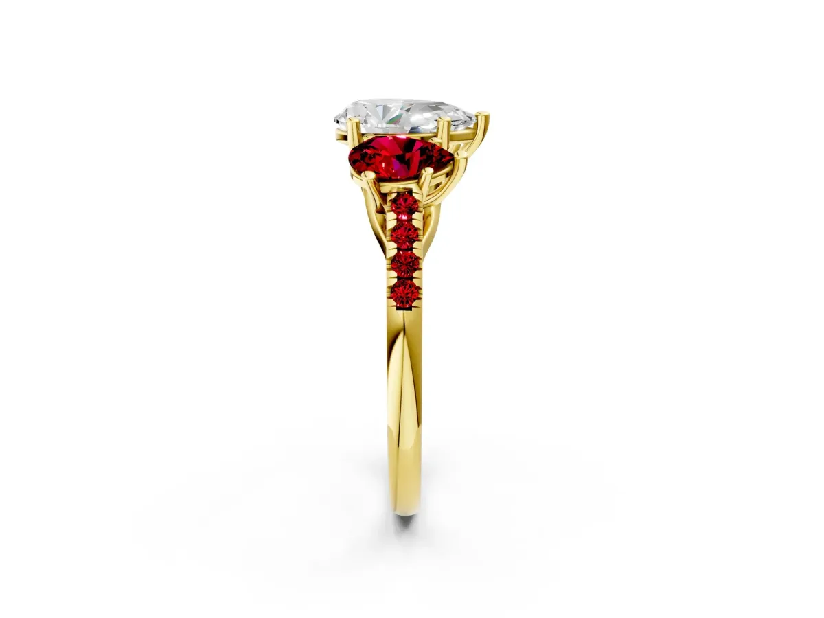 Three-Stone Pear Cut Diamond Ring with Round Ruby Pavé Band and Prong Setting Yellow gold