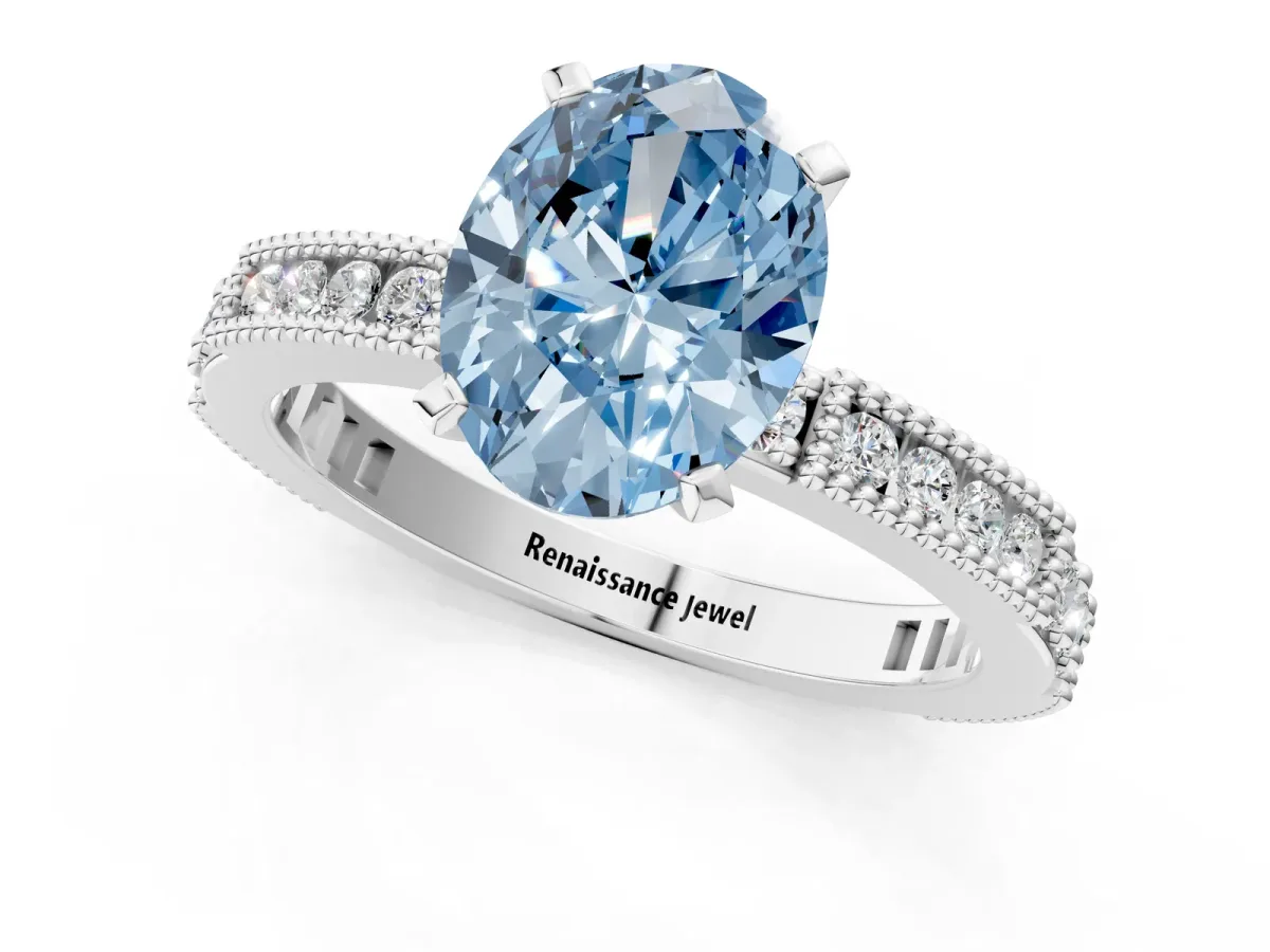 Fancy Blue Oval Cut Solitaire with Pavé Band and Four-Prong Setting Silver