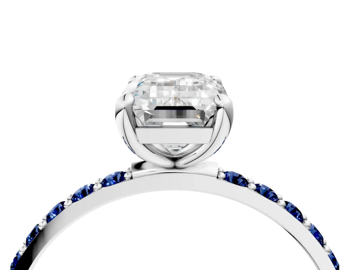 Emerald Cut Diamond Solitaire Ring with Round Blue Sapphire Pavé Band and Prong Setting Silver