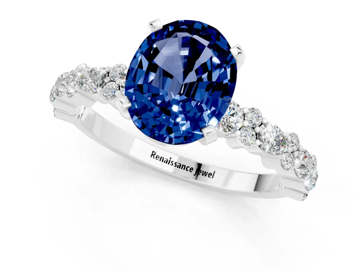 Oval Cut Blue Sapphire Side Stone Solitaire Ring with Round and Four-Prong Setting Platinum