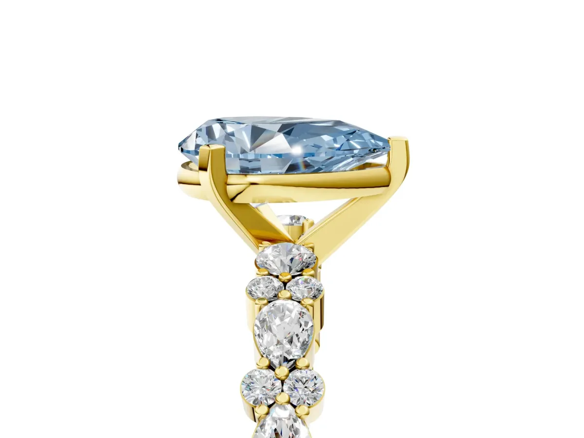Fancy Blue Pear Cut Diamond Side Stone Solitaire Ring with Round and Four-Prong Setting Yellow gold