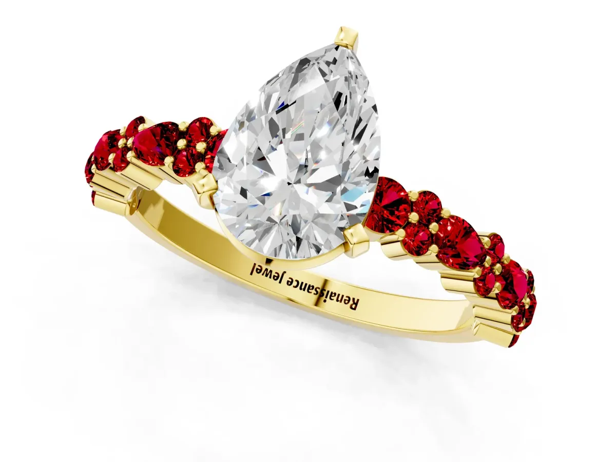 Pear Cut Diamond Side Stone Solitaire Ring with Round Ruby and Four-Prong Setting Yellow gold