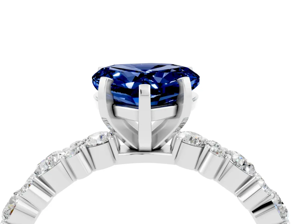 Heart Cut Blue Sapphire Side Stone Solitaire Ring with Round and Four-Prong Setting Platinum