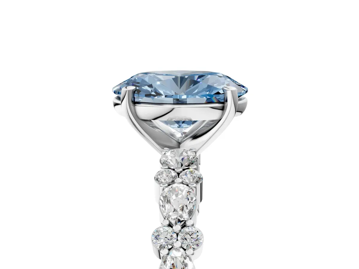 Fancy Blue Oval Cut Diamond Side Stone Solitaire Ring with Round and Four-Prong Setting White gold