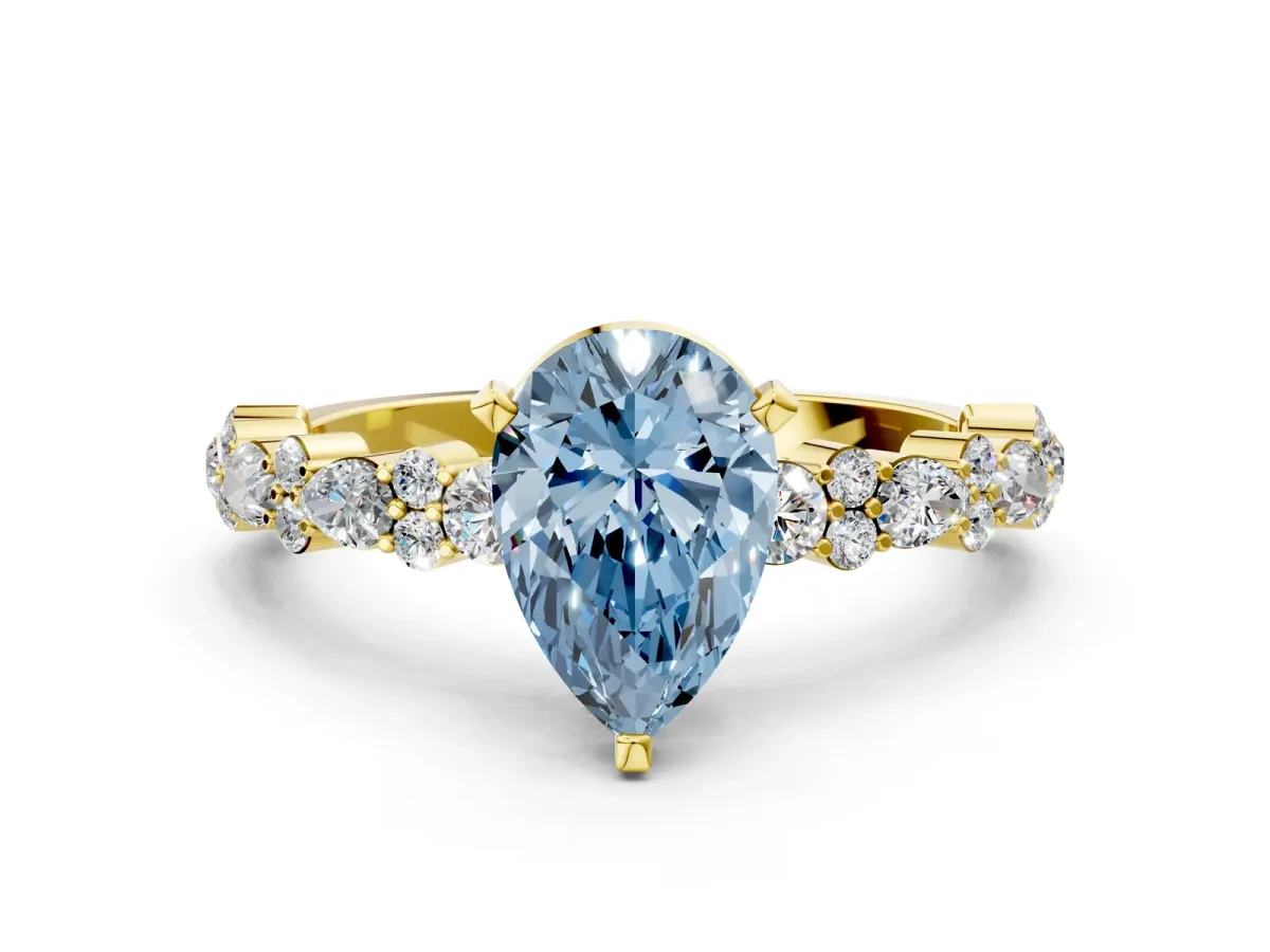 Fancy Blue Pear Cut Diamond Side Stone Solitaire Ring with Round and Four-Prong Setting Yellow gold