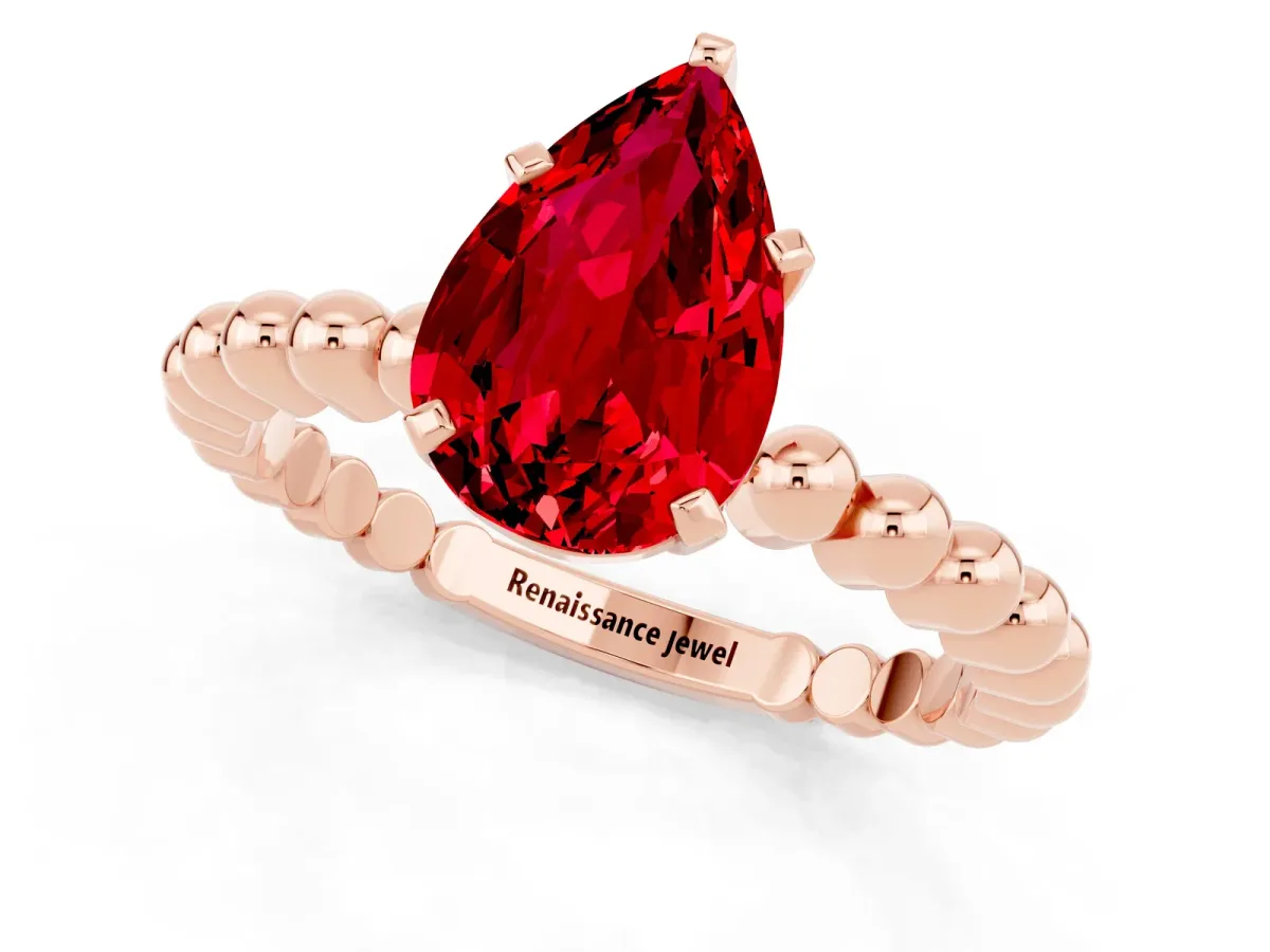 Pear Cut Ruby Solitaire Ring with Beaded Band and Prong Setting Rose gold
