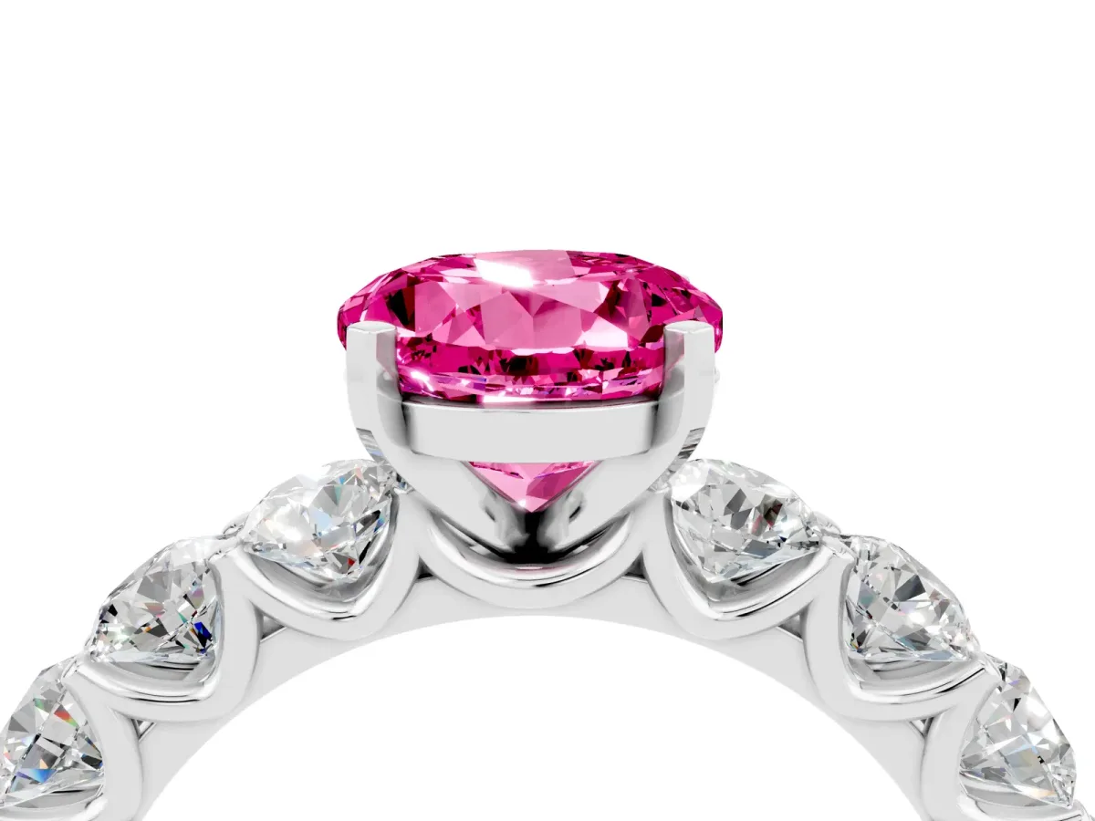Round Cut Pink Sapphire Prong Setting with Side Stones on a Pave Band Silver