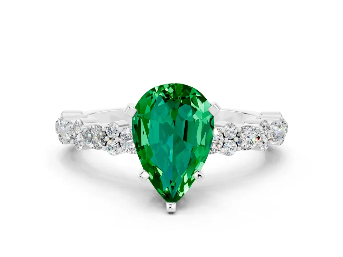 Pear Cut Emerald Side Stone Solitaire Ring with Round and Four-Prong Setting White gold