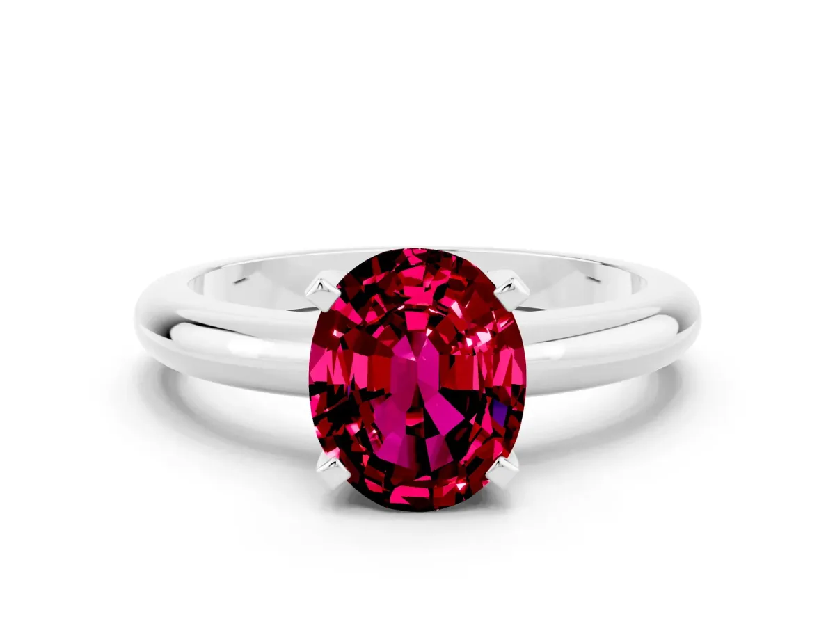 Oval Cut Garnet Solitaire Engagement Ring with Round Band and Four-Prong Setting Silver
