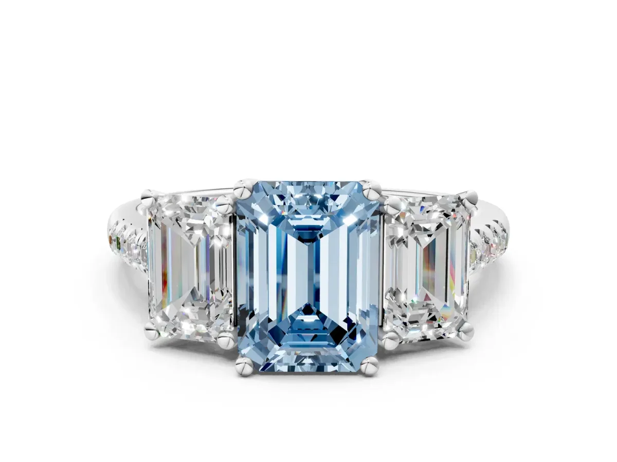 Fancy Blue Three-Stone Emerald Cut Diamond Ring with Round Pavé Band and Prong Setting Silver