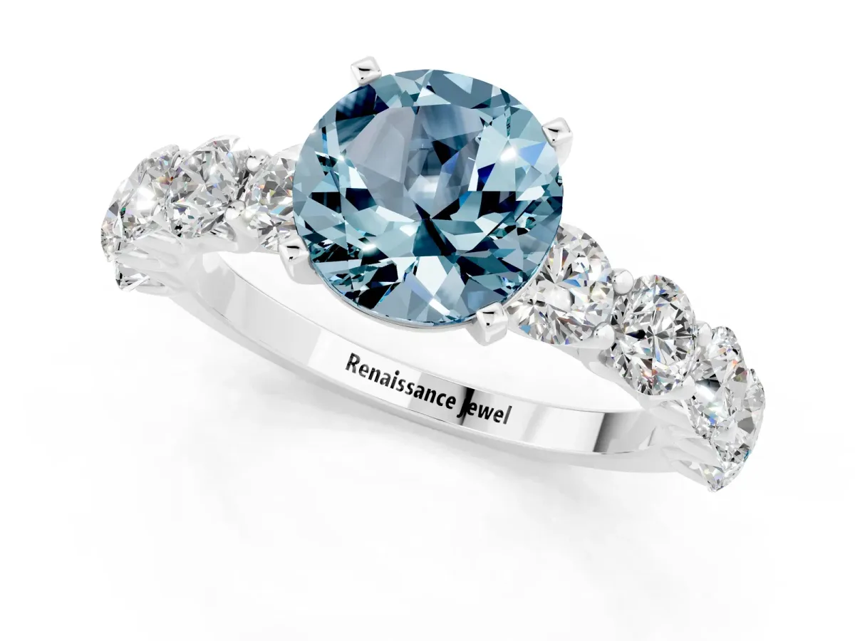 Round Cut Aquamarine Prong Setting with Side Stones on a Pave Band Silver