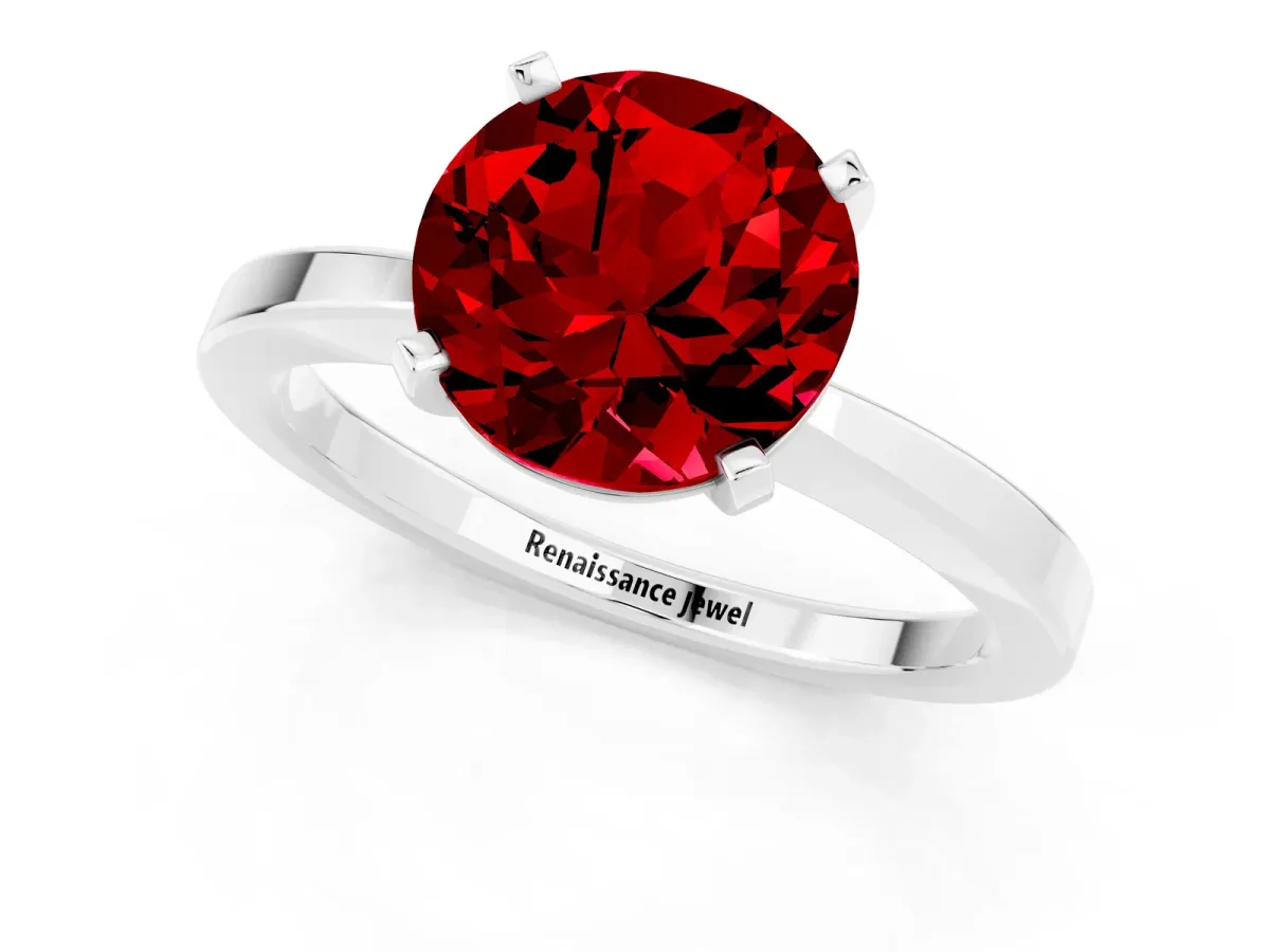Round Cut Ruby Solitaire Engagement Ring with Classic Band and Four-Prong Setting Silver