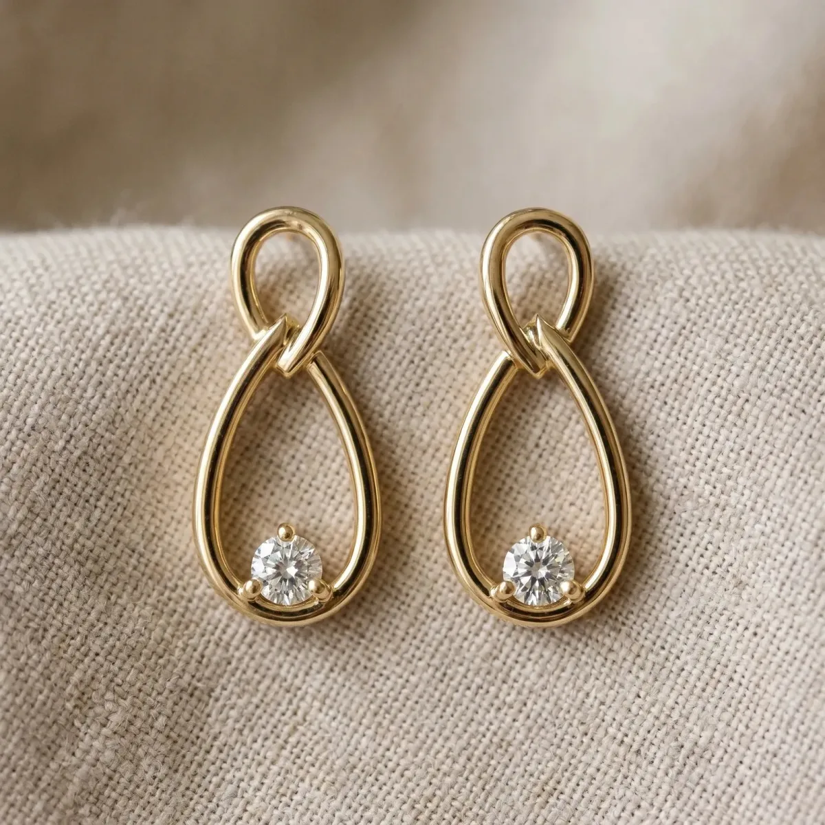 Round Diamond Teardrop Earrings with Bezel Setting and Loop Band Yellow gold