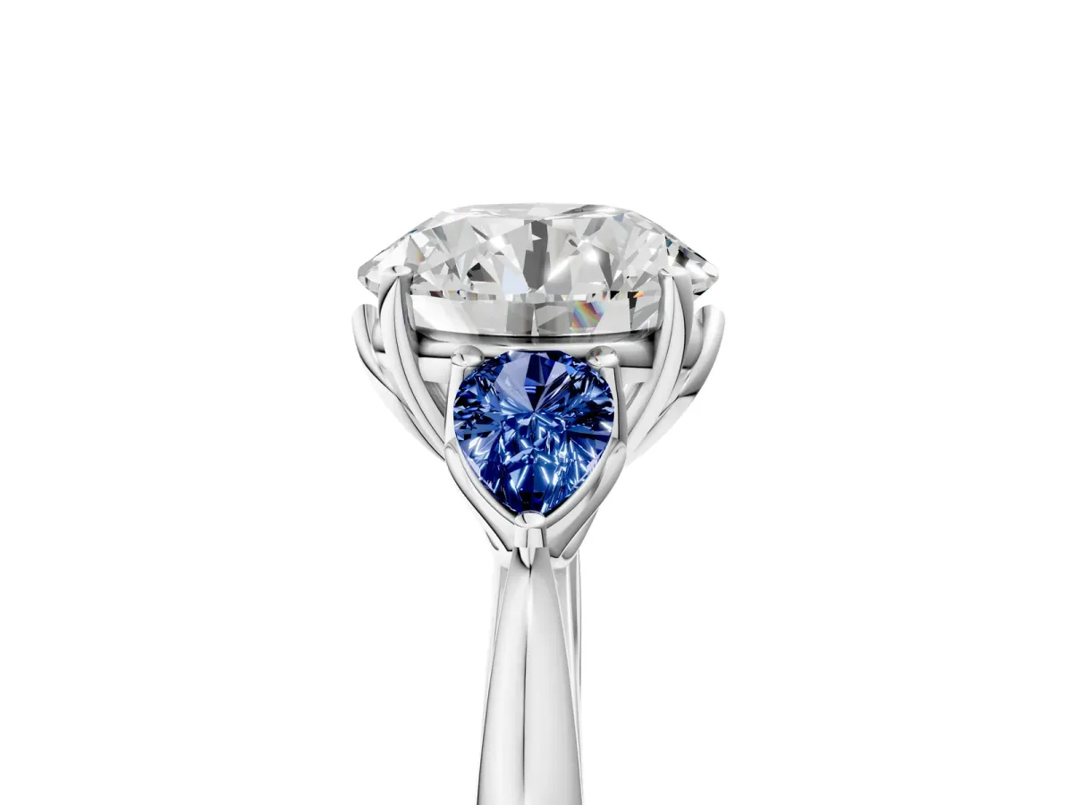Round Cut Diamond Three-Stone Ring with Pear Blue Sapphire Side Stones and Prong Setting Silver