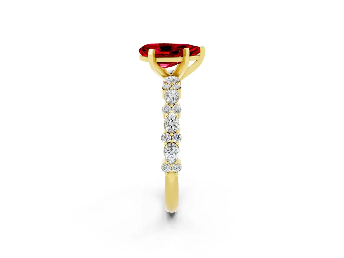 Pear Cut Ruby Side Stone Solitaire Ring with Round and Four-Prong Setting Yellow gold