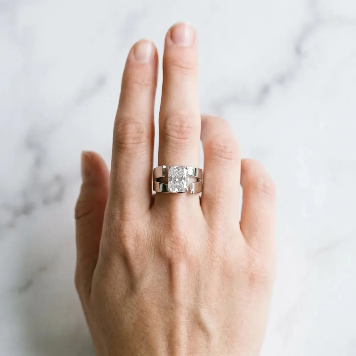 Modern Tension Set Radiant Cut Diamond Solitaire Wide Band Ring Silver