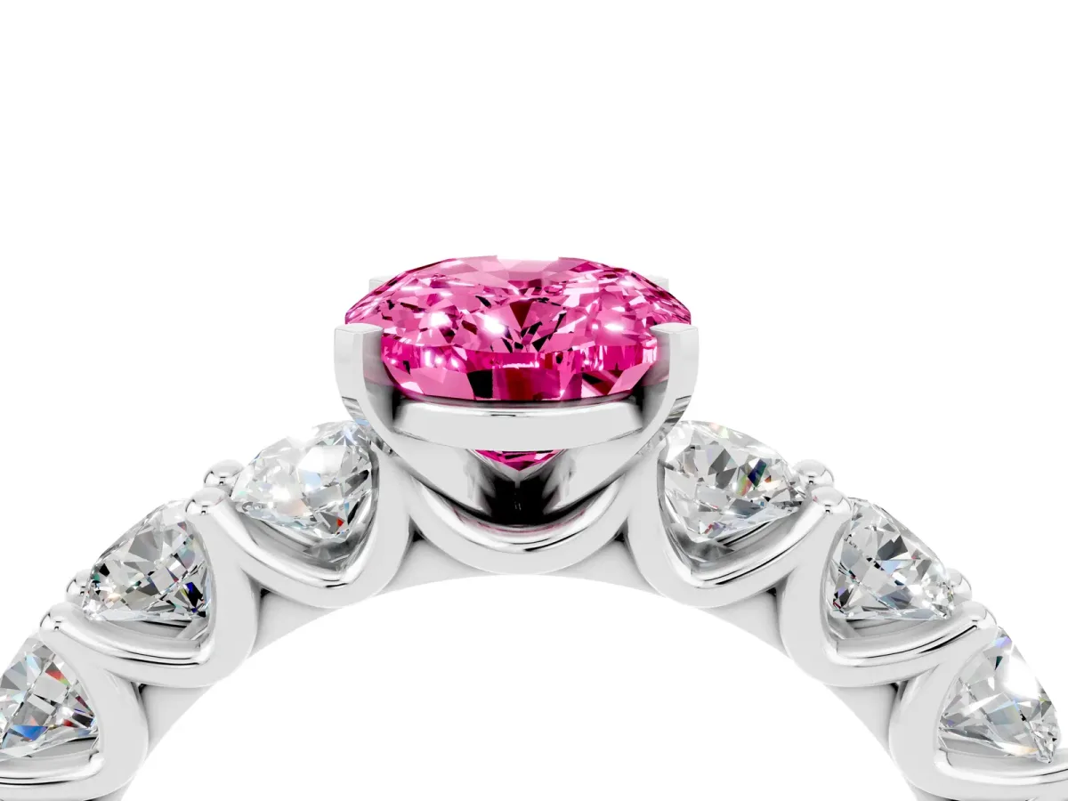 Oval Cut Pink Sapphire Prong Setting with Side Stones on a Pave Band Silver