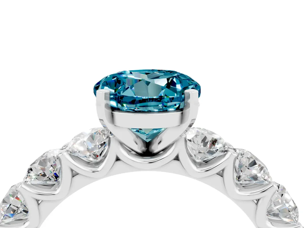 Round Cut Blue Topaz Prong Setting with Side Stones on a Pave Band Silver