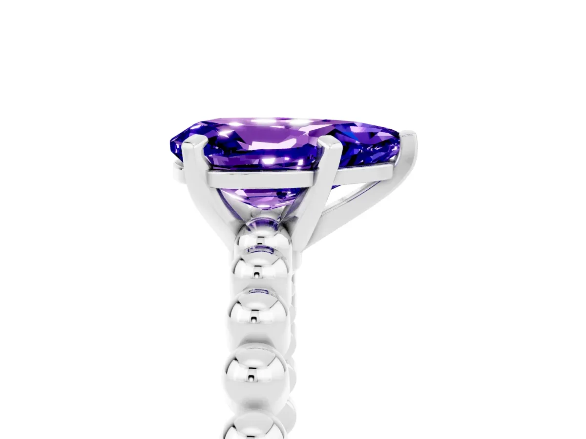 Pear Cut Tanzanite Solitaire Ring with Beaded Band and Prong Setting Silver