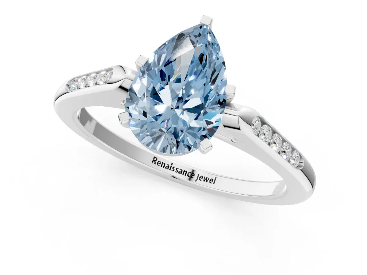 Fancy Blue Pear Cut Diamond Solitaire Ring with Channel Set Round Band and Prong Setting Silver
