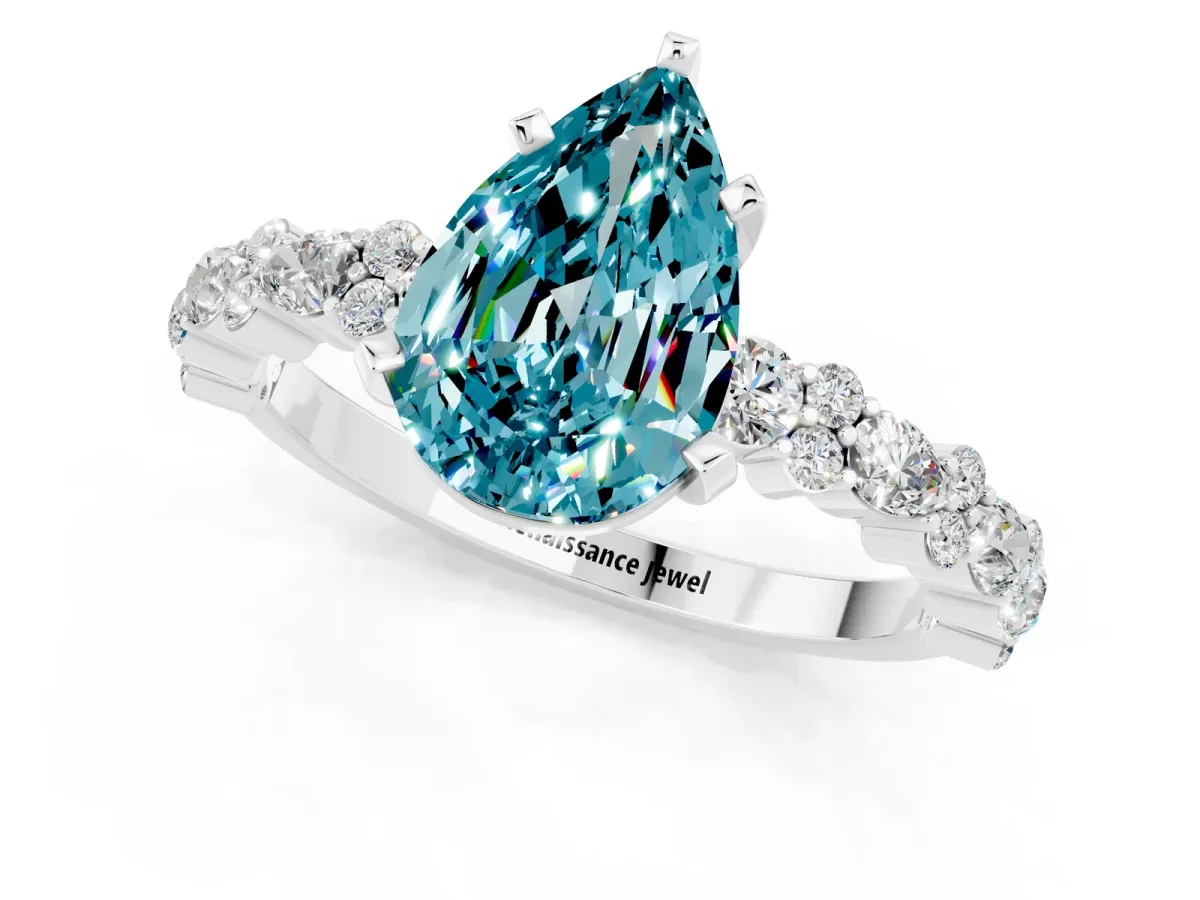 Pear Cut Blue Topaz Side Stone Solitaire Ring with Round and Four-Prong Setting Silver