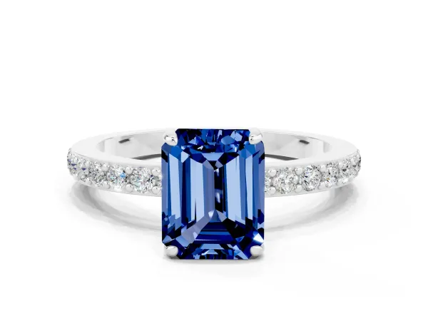 Emerald Cut Blue Sapphire Solitaire Engagement Ring with Pavé Band and Four-Prong Setting Platinum