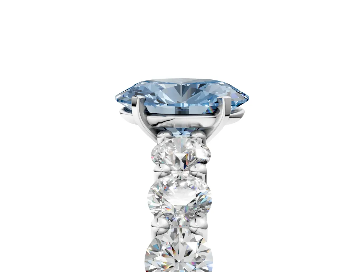 Fancy Blue Oval Cut Diamond Prong Setting with Side Stones on a Pave Band Platinum