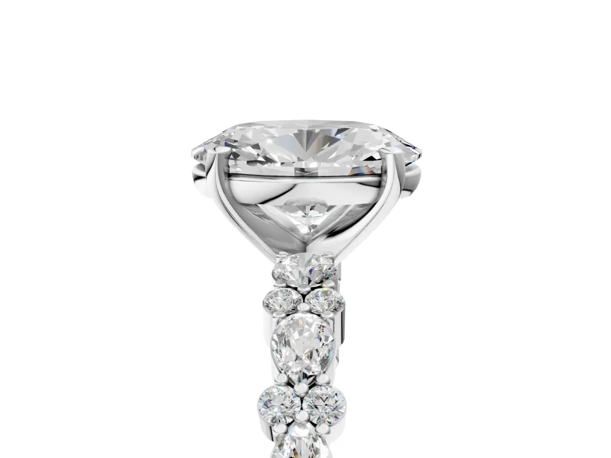 Oval Cut Diamond Side Stone Solitaire Ring with Round and Four-Prong Setting White gold