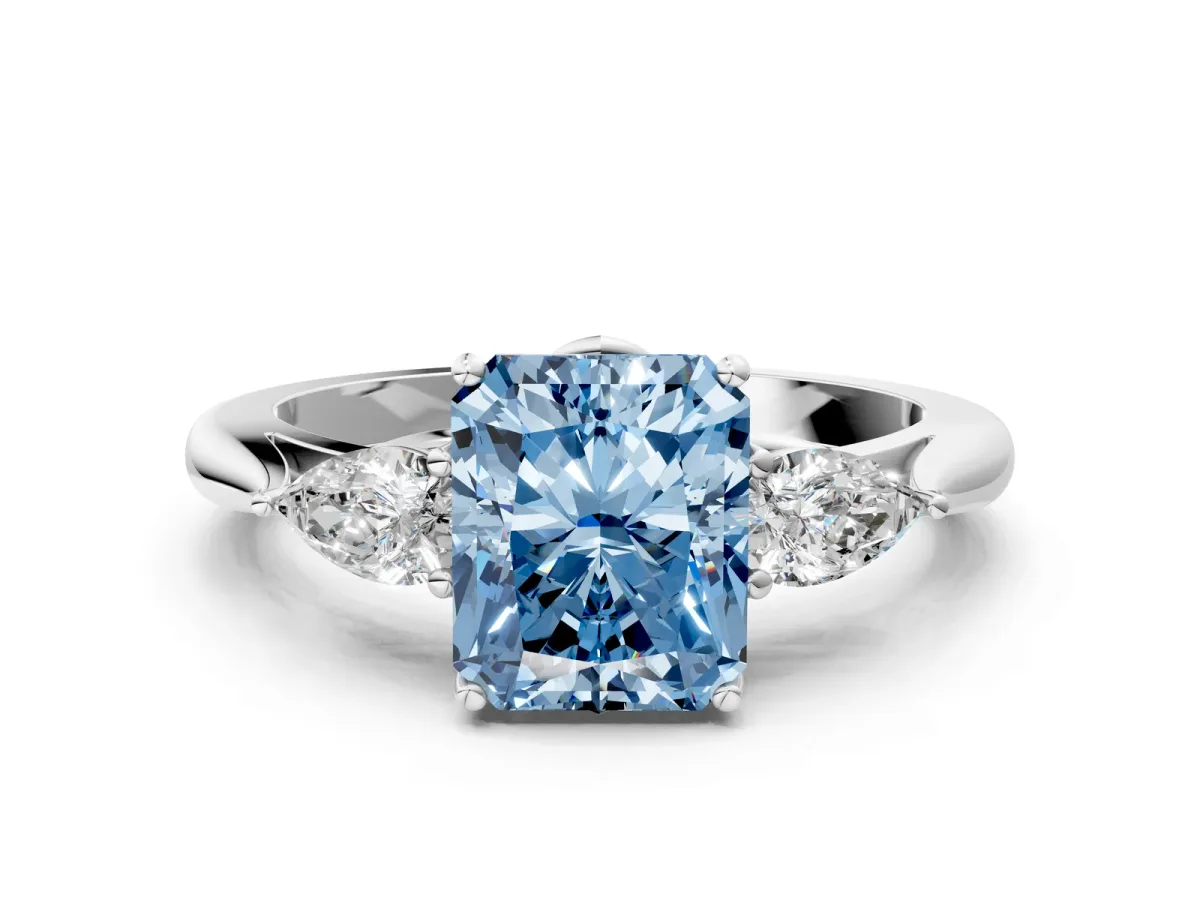 Fancy Blue Three-Stone Radiant Cut Diamond Ring with Pear Side Stones in Four-Prong Setting Platinum