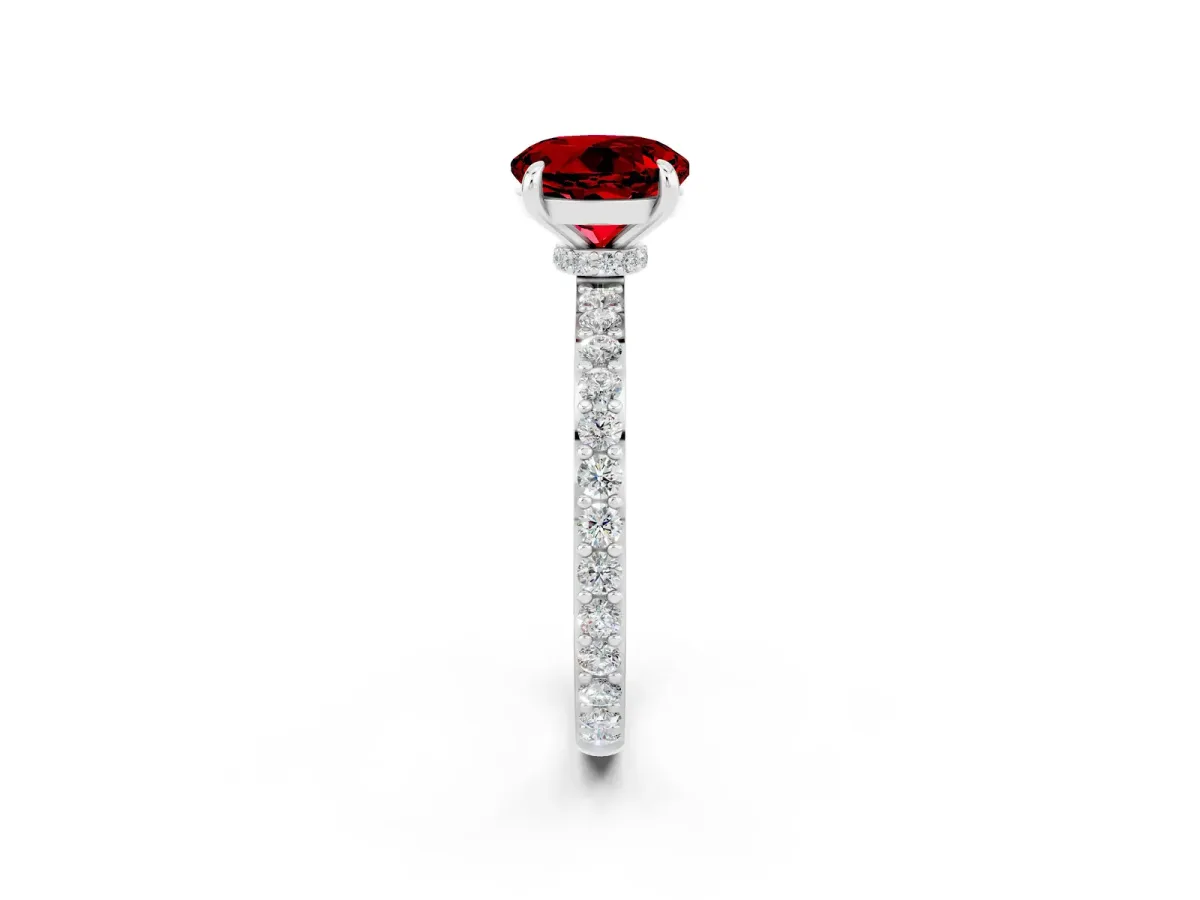 Round Cut Ruby Solitaire Engagement Ring with Pavé Band and Four-Prong Setting Silver