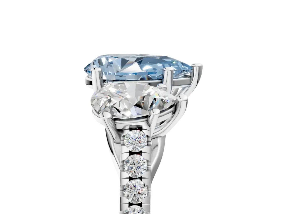 Fancy Blue Three-Stone Pear Cut Diamond Ring with Round Pavé Band and Prong Setting Platinum