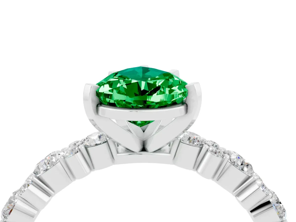 Pear Cut Emerald Side Stone Solitaire Ring with Round and Four-Prong Setting White gold