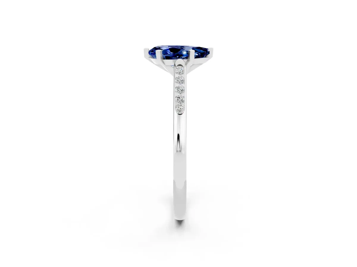Pear Cut Blue Sapphire Solitaire Ring with Channel Set Round Band and Prong Setting Silver