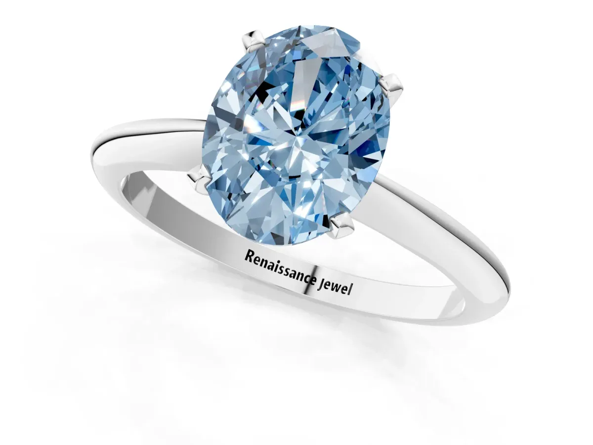 Fancy Blue Oval Cut Diamond Solitaire Engagement Ring with Classic Band and Four-Prong Setting Silver